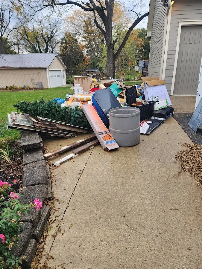 Dumpster being loaded with debris for 3 Yard Dumpster Rental in Beloit
